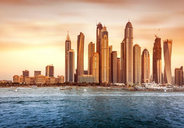 Beautiful Dubai cityscape, panoramic view of the modern city on the bank of gulf in sunset light, famous touristic place, United Arab Emirates